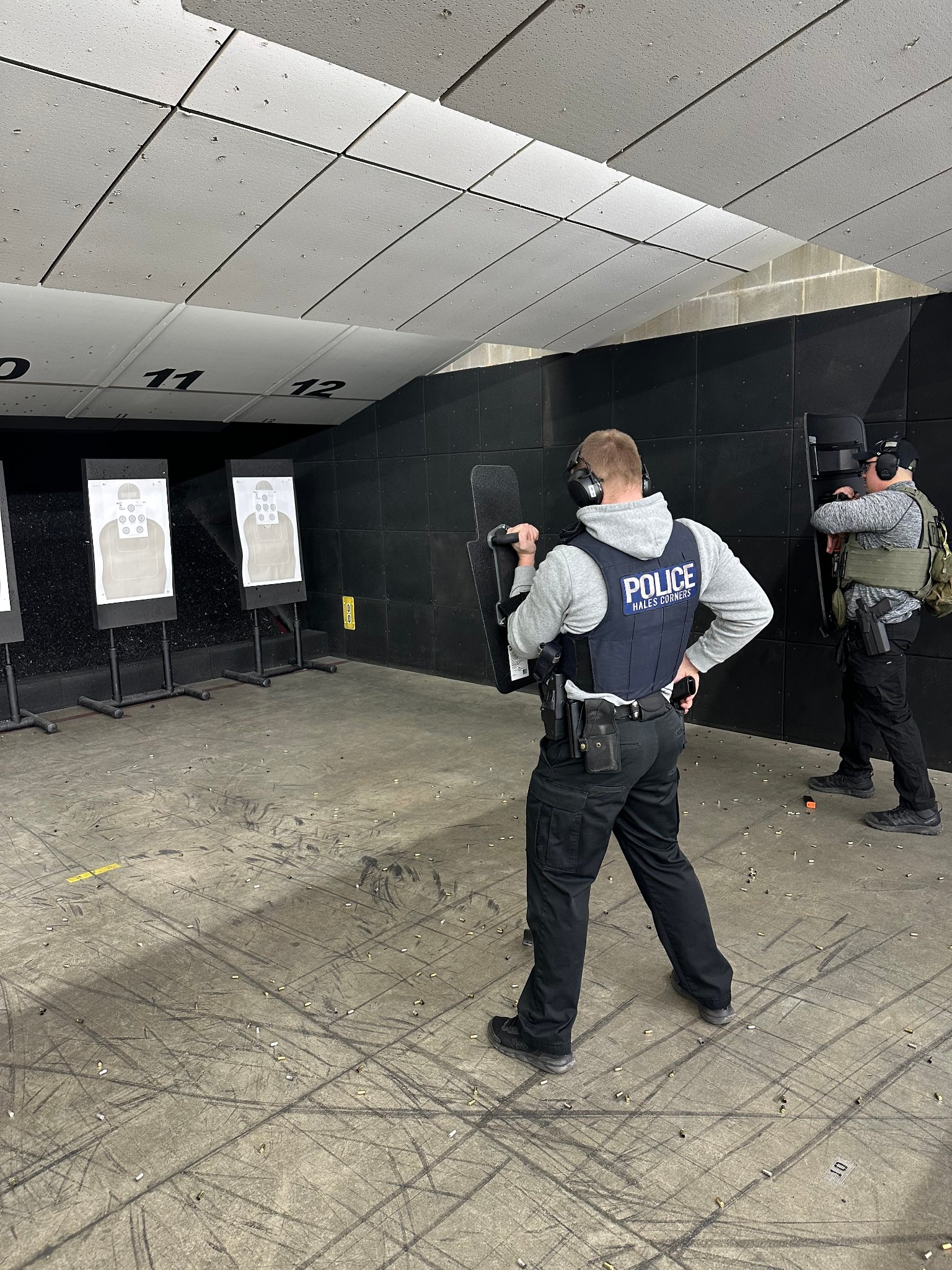 Police officer ballistic shield training — indoor range
