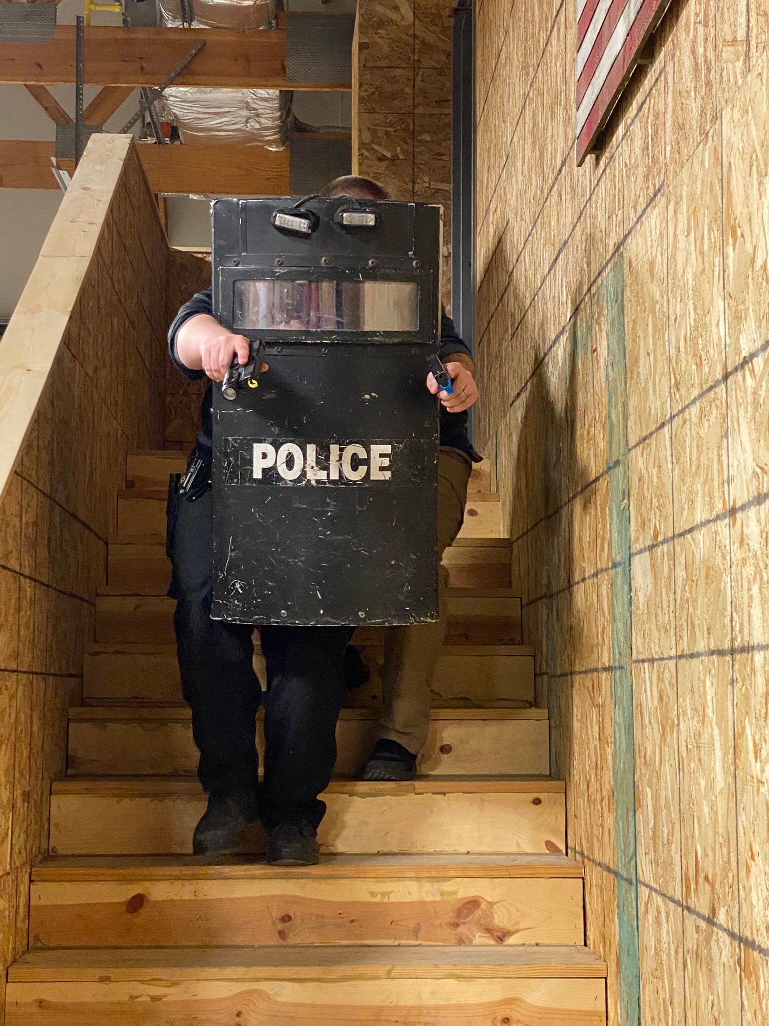 Police ballistic shield stairwell drill