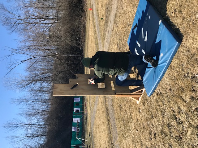 Kneeling pistol drill — outdoor range barricade
